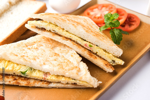Indian Bread omelette / omlet / omlete sandwich served with tomato ketchup
