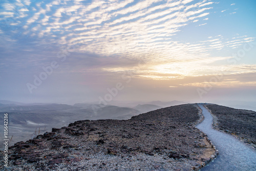 Colorful landscape view on judean desert land with magic sky on background and color clouds