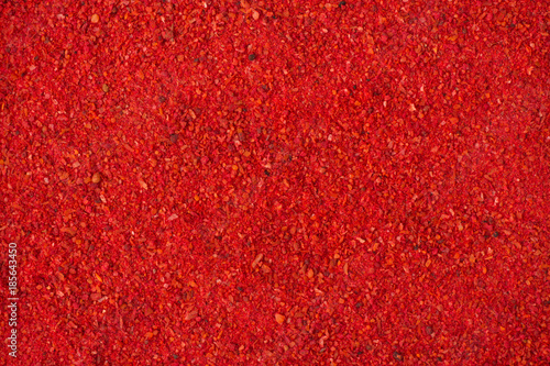 Foto paprika powder spice as a background, natural seasoning texture