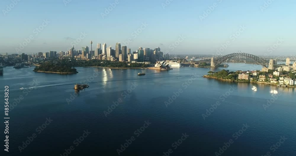 Sydney harbour towards city CBD landmarks from Cremorne point forward flying in morning time.
Sydney harbour towards city CBD landmarks from Cremorne point forward flying in morning time.
