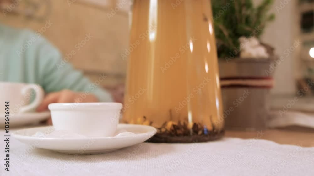 Happy girl drinking tea and relaxing in cafe, smiling and looking at camera. Happy girl drinking tea and relaxing in cafe, smiling and looking at camera.