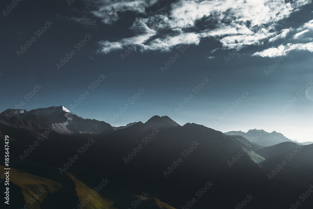 Scenic mountain landscape, mountain ranges silhouette at dawn