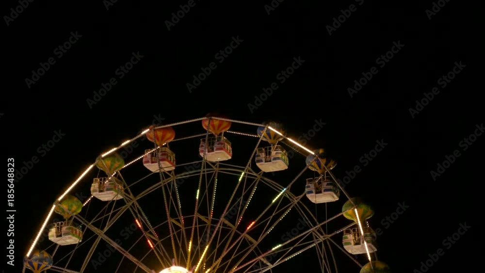 Big wheel carousel attraction slowly rotating in the night. Vacation and relaxing Big wheel carousel attraction slowly rotating in the night. Vacation and relaxing
