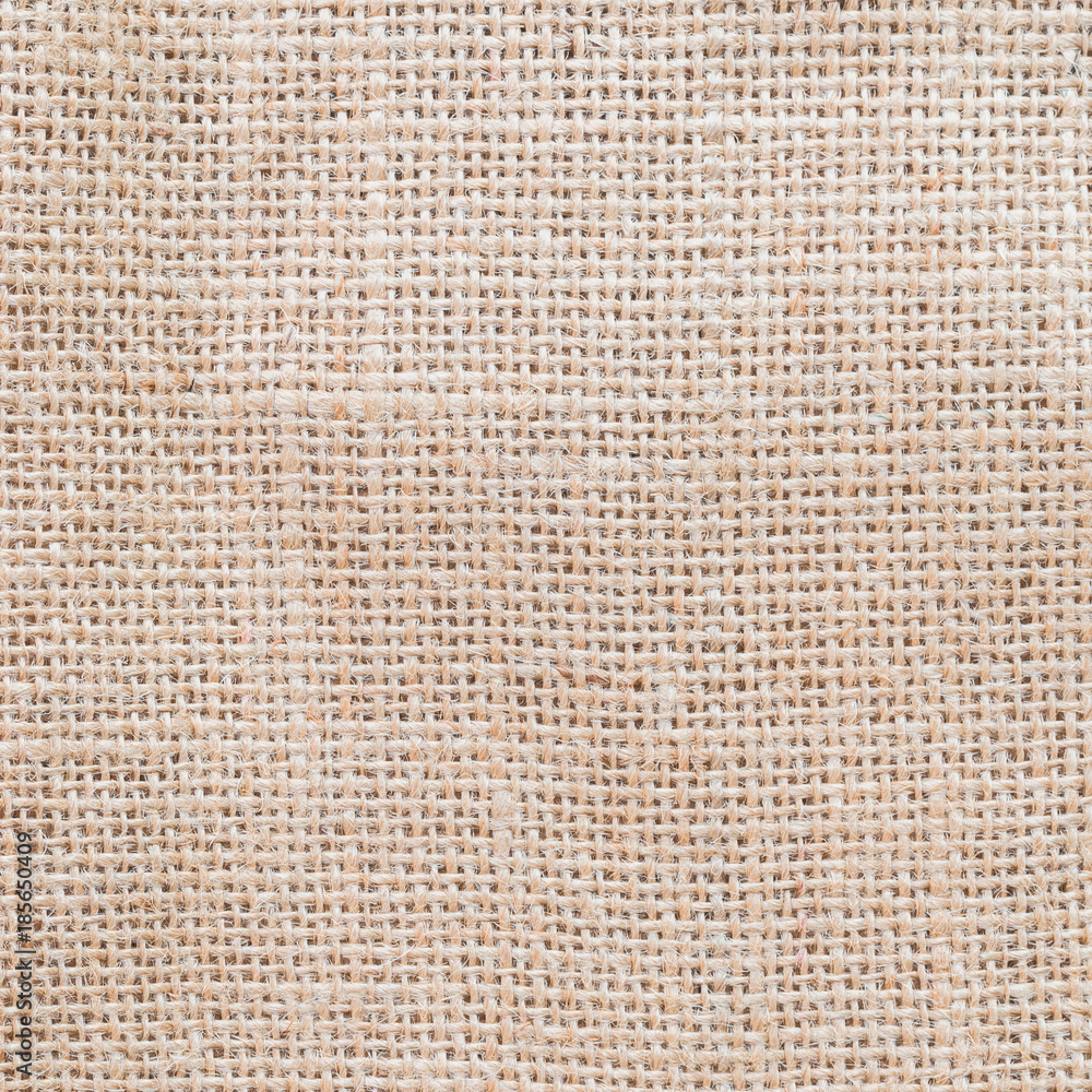 Fototapeta premium Jute hessian sackcloth woven burlap texture background in beige cream brown color