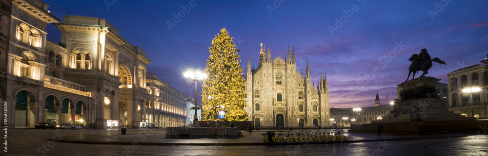 Milan, Italy: Panoramic view of the Duomo square with the illuminated Christmas tree, the Milan cathedral and the Vittorio Emanuele II Gallery.
