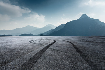international circuit asphalt ground and mountain nature landscape in foggy day