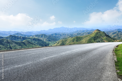 empty asphalt highway in the mountains