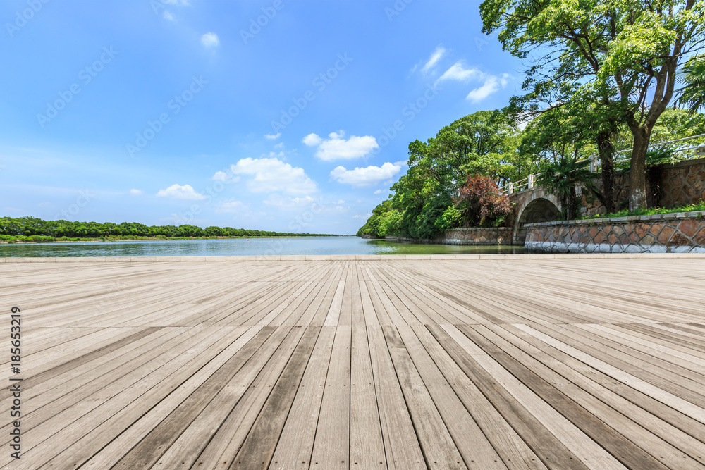 wooden board observation deck and lake landscape in city park wooden board observation deck and lake landscape in city park