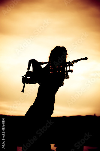 Man Playing The Bagpipe