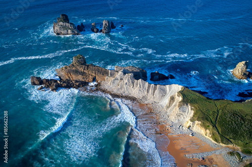 aerial view of amazing rock formations on the Arnia beach, Costa Quebrada, Cantabria, Northern Spain