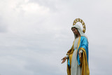 Saint Mary statue against the blue sky