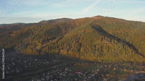 Sunrise in autumn carpathian mountains near by Mykulychyn village, Ukraine photo