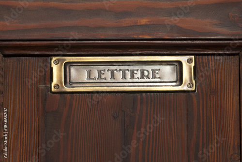 Brown letterbox on the door photo