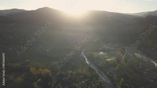 Sunrise in autumn carpathian mountains near by Mykulychyn village, Ukraine photo