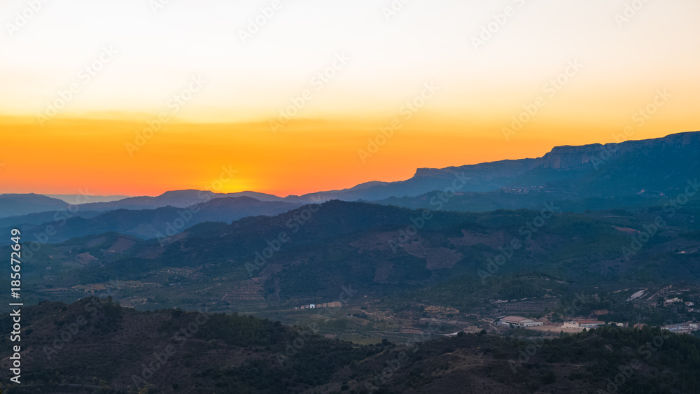 View of the mountain landscape at sunset in Siurana de Prades, Tarragona, Spain. Copy space for text. View of the mountain landscape at sunset in Siurana de Prades, Tarragona, Spain. Copy space for text.
