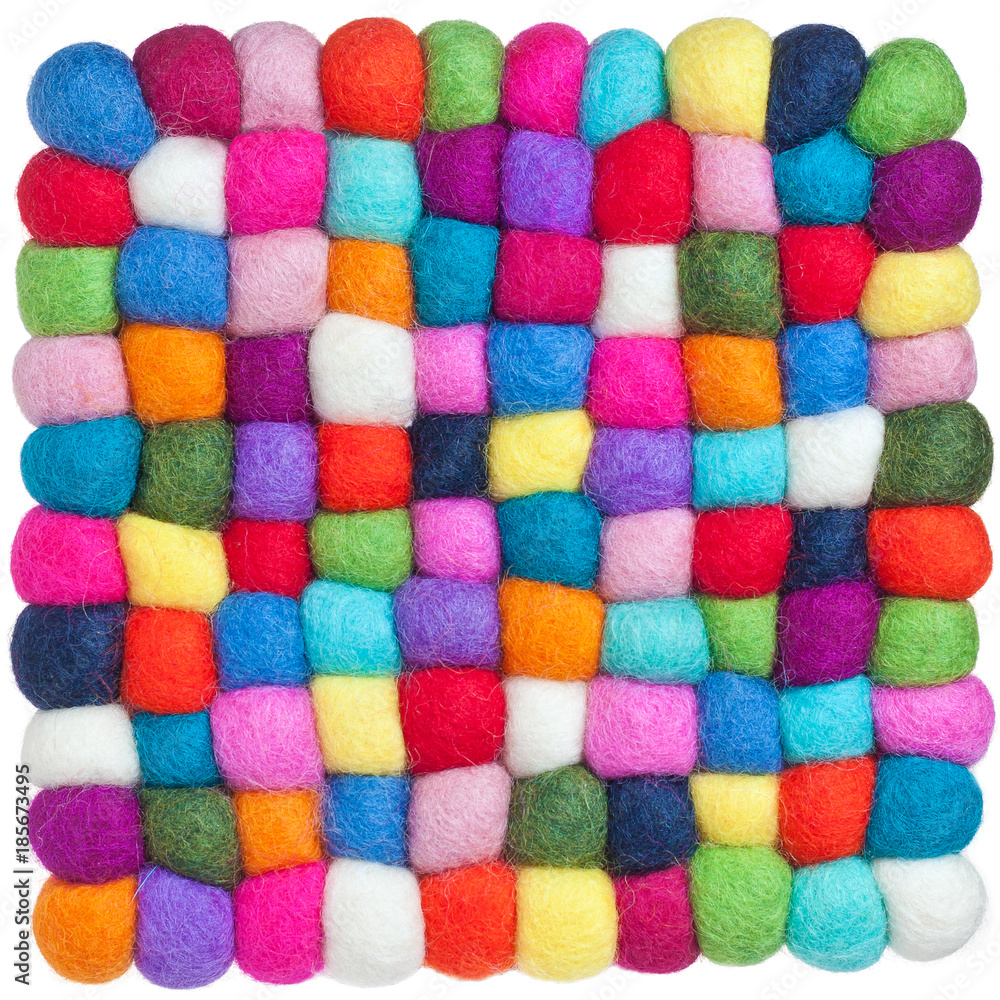 Knitted soft stand on a table under hot dishes of large multi-colored thread isolated on white background, seamless texture. Knitted soft stand on a table under hot dishes of large multi-colored thread isolated on white background, seamless texture.
