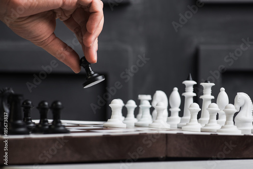 a man plays chess