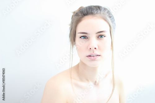 portrait of a girl in high key on white background