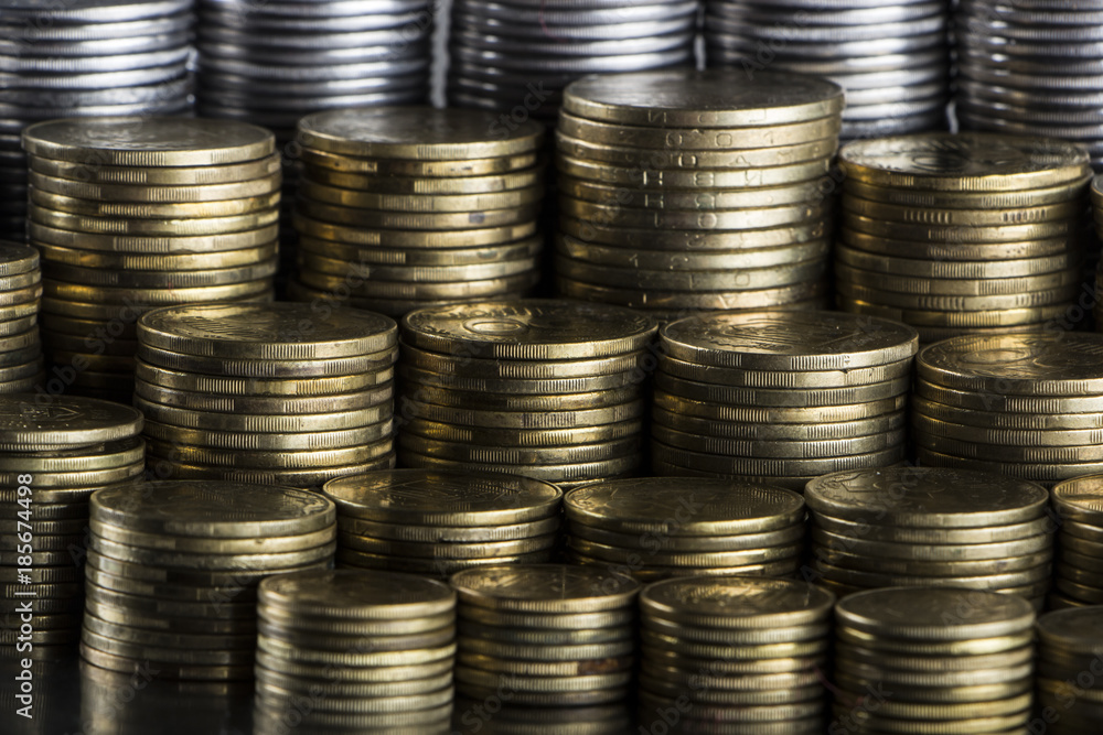 Stack of coins on a metal surface close-up. Stack of coins on a metal surface close-up.
