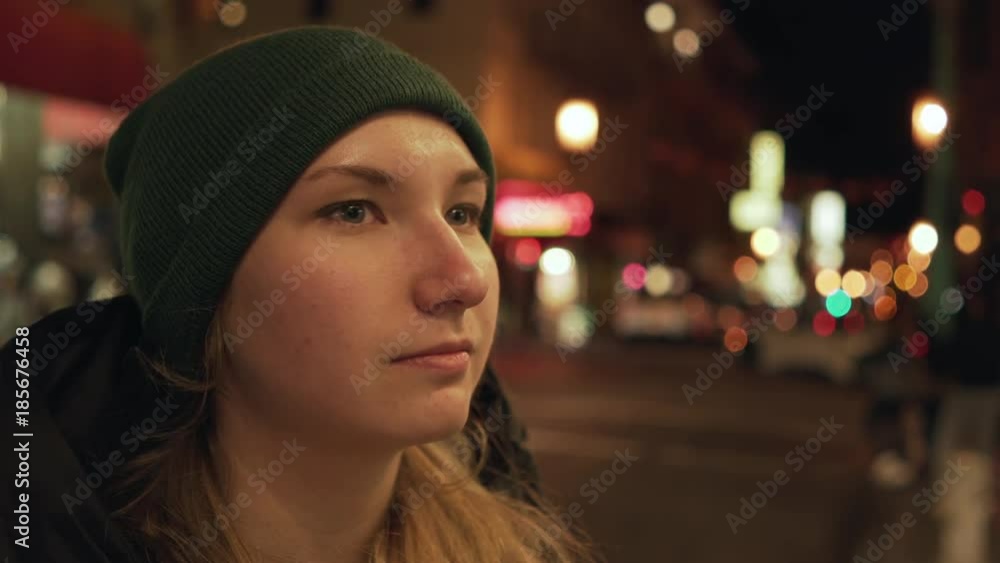 gimbal shot of teen girl standing on street of Chinatown in San Francisco at night gimbal shot of teen girl standing on street of Chinatown in San Francisco at night