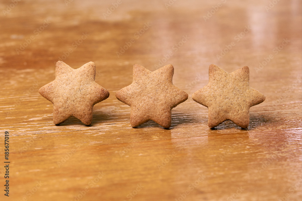 Three ginger cookies. Shape star. Blurred Background Three ginger cookies. Shape star. Blurred Background