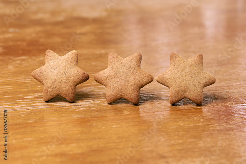 Three ginger cookies. Shape star. Blurred Background