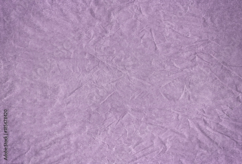 Purple blank crumpled and grungy textured paper background