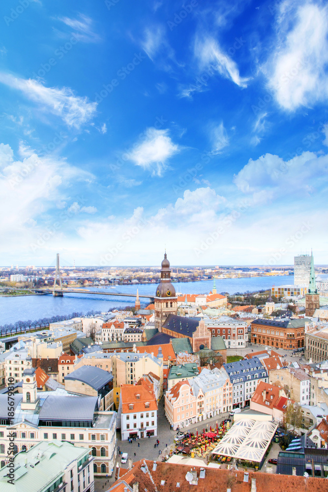 eautiful view of the old town and the steeple of the Dome Cathedral near the Daugava River in Riga, Latvia