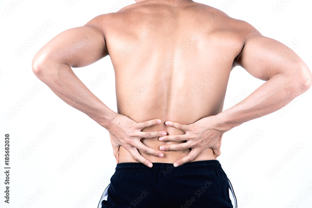 Fitness and health concept. Fit sport man having back injury, isolated on white background in studio. Half naked Asian chinese lean muscular male wearing a black shorts.