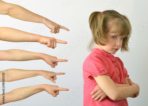 many hands are pointing fingers at the child ,kid of the outcast conceptual photography