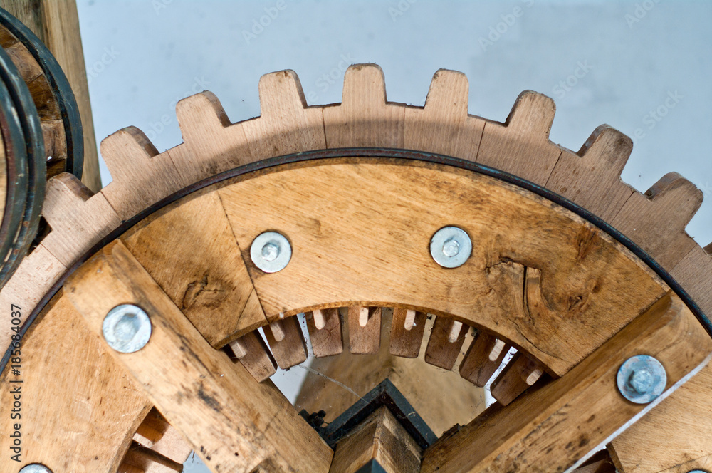 historical gears in wood and metal with wheels and teeth