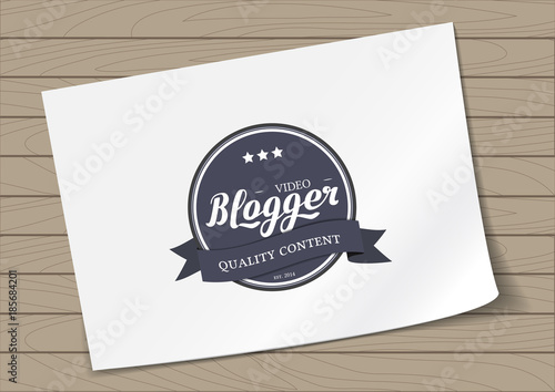 Round Badge Video Blogger with Hand Drawn Lettering Isolated on A4 Sheet Template Wooden Background. Black Logo Emblem Vector Illustration. Can be used for Logotype, Branding.