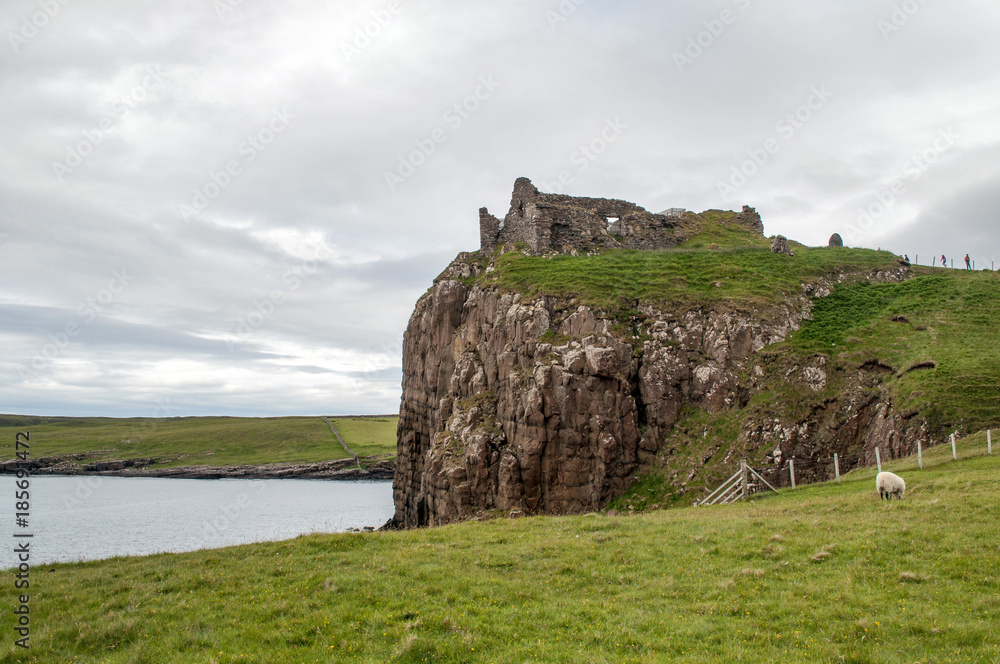 Rocks above the sea on the coast of Skye in Duntulm Castle, Scotland