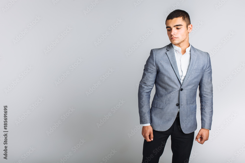 Portrait of the beautiful posing in a Studio, White background, Stylish business man Portrait of the beautiful posing in a Studio, White background, Stylish business man