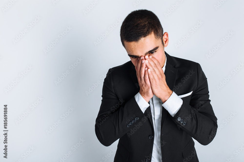 Frustrated man in Studio on white background, isolated, business style, stylish, suit Frustrated man in Studio on white background, isolated, business style, stylish, suit