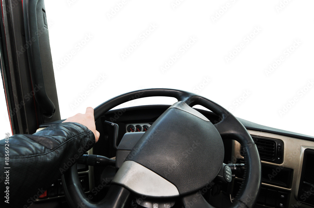 Truck dashboard with driver's hand on the steering wheel isolated on a white background