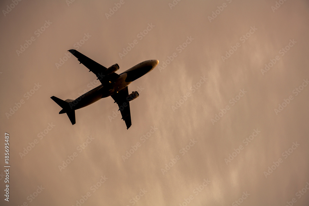 Airplane take off silhouette with sunlight in background. Airplane take off silhouette with sunlight in background.