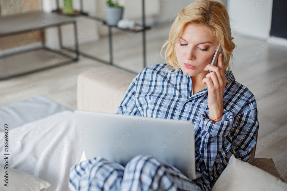 Portrait of concentrated girl at home spending time with gadgets with comfort. Copy space in left side Portrait of concentrated girl at home spending time with gadgets with comfort. Copy space in left side