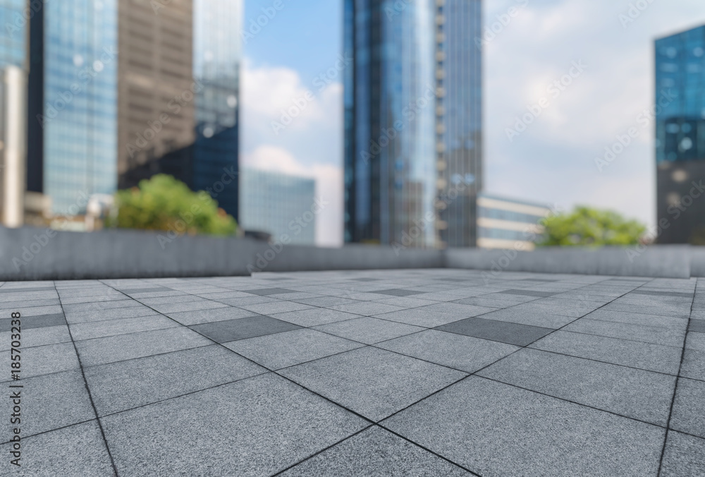 Fototapeta premium empty pavement and modern buildings in city