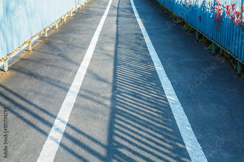 Asphalt road with white stripes © hallojulie