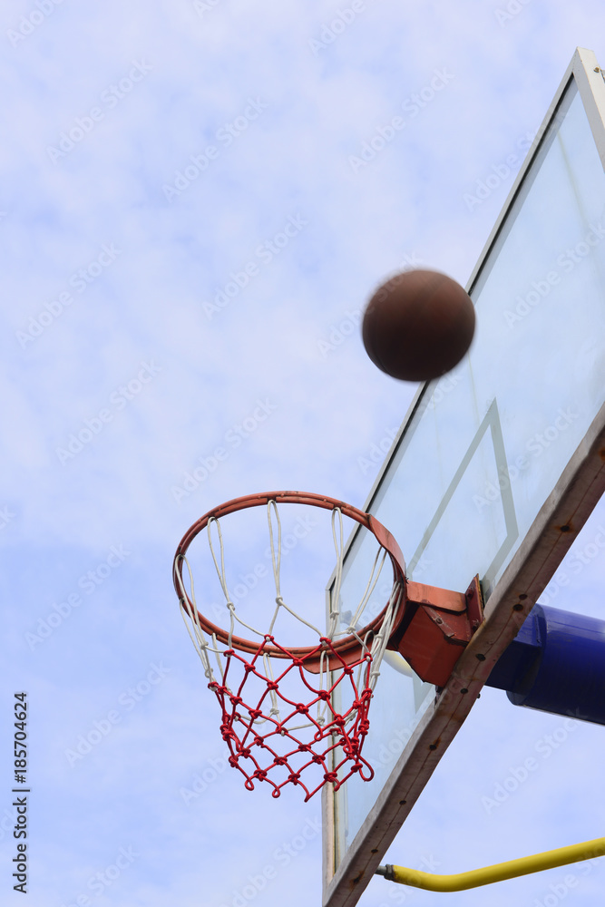 Basketball shooting under the blue sky, close-up Basketball shooting under the blue sky, close-up