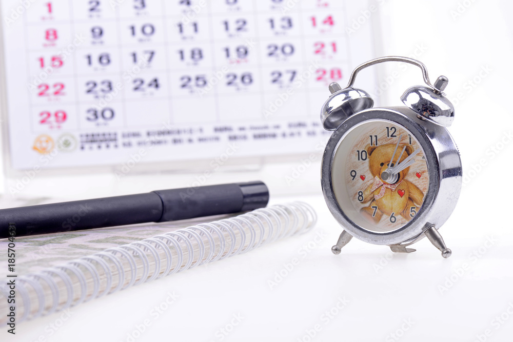 Open the calendar, alarm clock and a laptop Open the calendar, alarm clock and a laptop