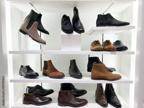 Picture of the store shelf with men's shoes.