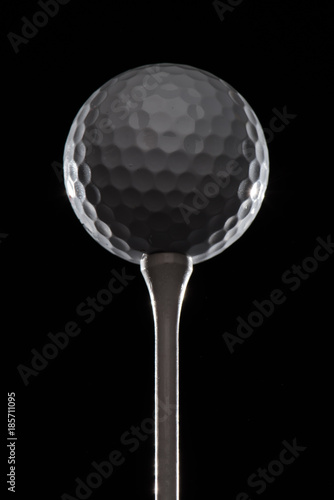 Golf ball on golf tee highlighted