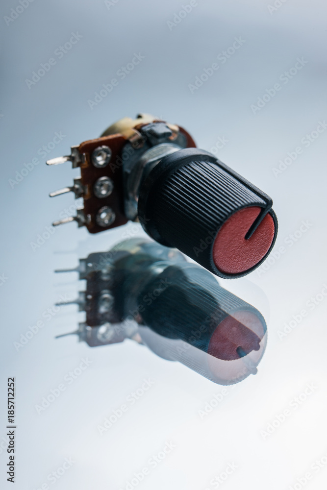 variable resistor on a white background. apparatus regulating the
