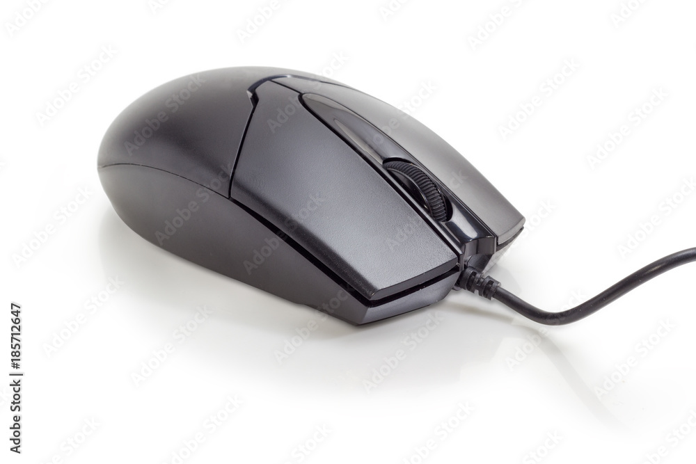 Black typical cabled computer mouse on a matte surface closeup