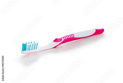 Toothbrush on a white matte surface closeup