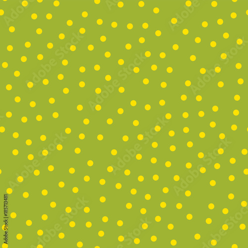 Yellow polka dots seamless pattern on green background. Lovely classic yellow polka dots textile pattern in restrained colours. Seamless scattered confetti fall chaotic decor. Vector illustration.