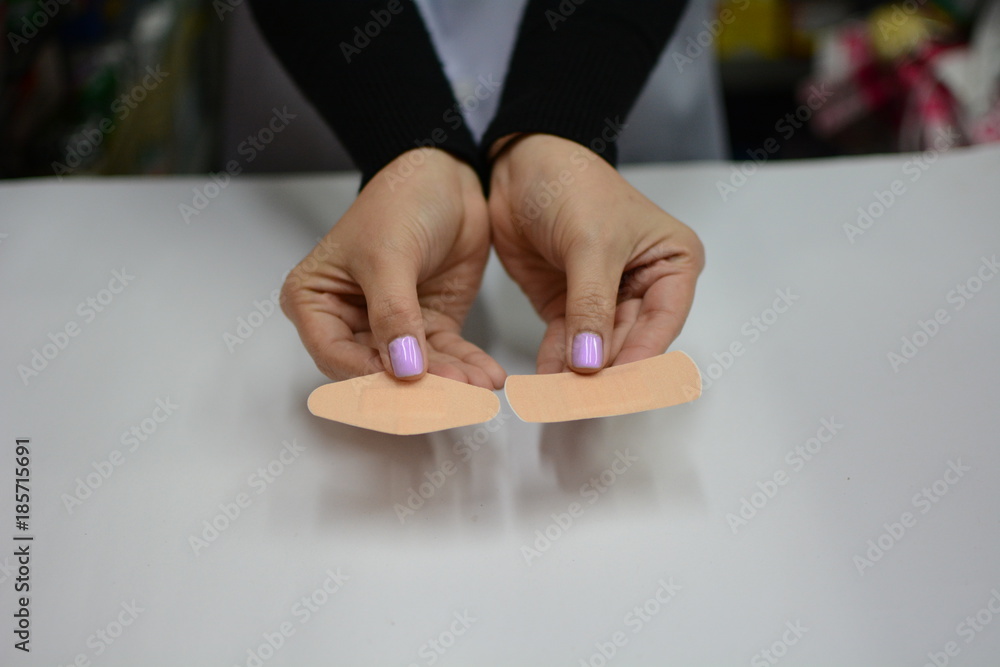 Female doctor hand hold pack of different tablet blisters at workplace Female doctor hand hold pack of different tablet blisters at workplace