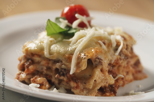 classic lasagna on white plate on table